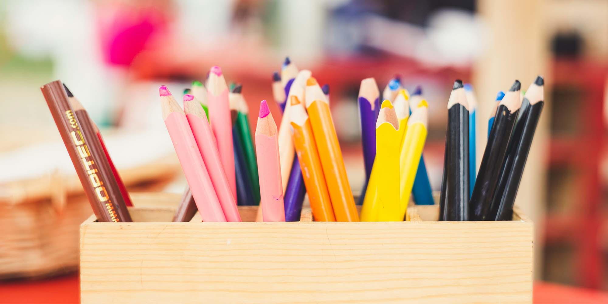 colored pencils in wood holder